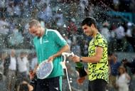 Jan-Lennard Struff (L) and Carlos Alcaraz (R) during the post-match trophy presentation ceremony at the 2023 Mutua Madrid Open